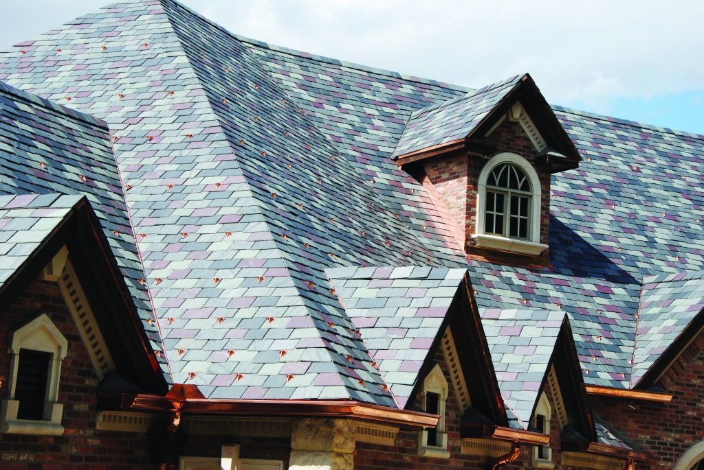 Slate roof with copper roofing accents installed by ATR Roofing