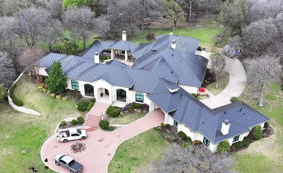 Standing seam metal panels across a complex residential roof